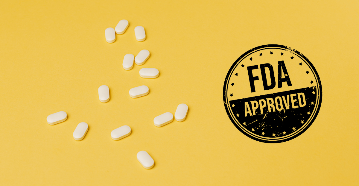 Niro Approval_2023 11 28_Featured Image (1200 x 624 px) A photo of white prescription tablets scattered on a yellow background with a black stamp that reads "FDA Approved"