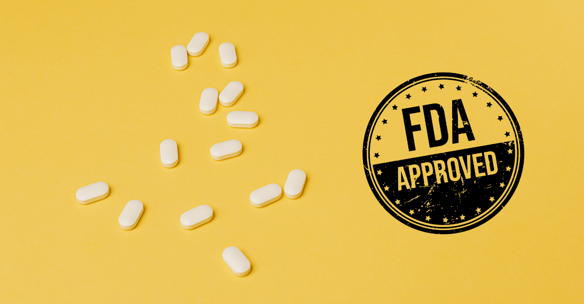 A photo of white prescription tablets scattered on a yellow background with a black stamp that reads "FDA Approved"